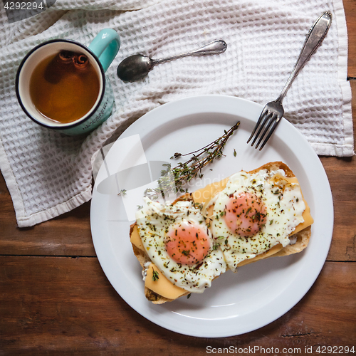 Image of Scrambled eggs with cheese on bread, close up view