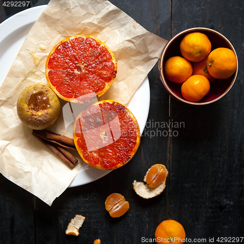 Image of Baked apples and grapefruit at wooden table