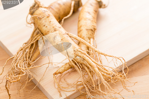 Image of Korean Fresh ginseng over wooden background