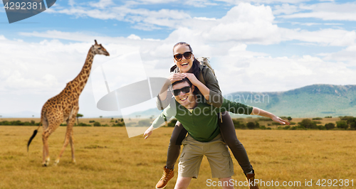 Image of smiling couple with backpacks traveling in africa