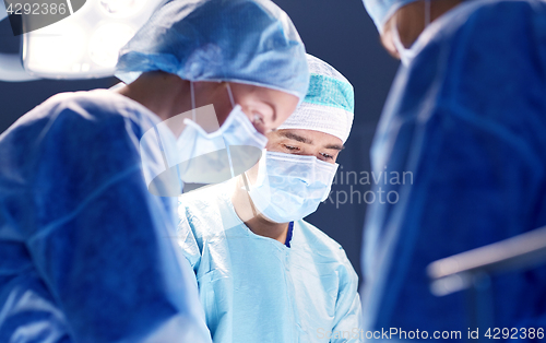 Image of group of surgeons in operating room at hospital