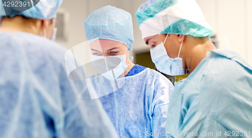 Image of group of surgeons in operating room at hospital