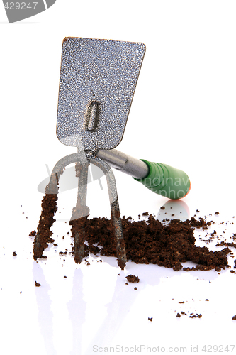 Image of weeder hoe and earth