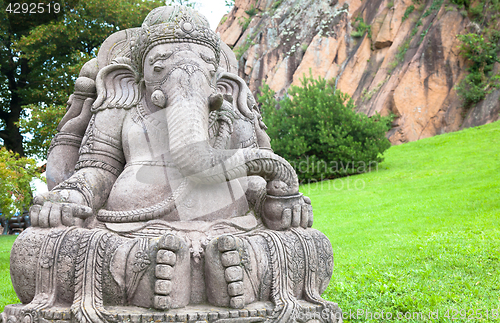 Image of Ganesha statue in a beautiful mountain garden