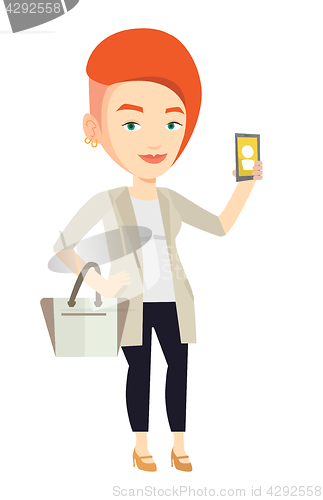 Image of Woman holding ringing mobile phone.