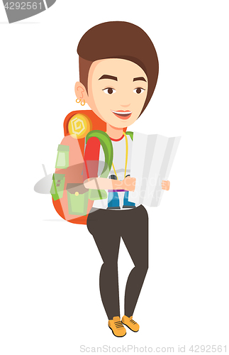 Image of Traveler with backpack looking at map.