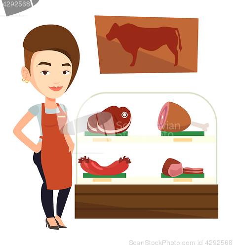 Image of Butcher offering fresh meat in butchershop.