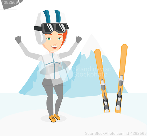 Image of Cheerful skier standing with raised hands.