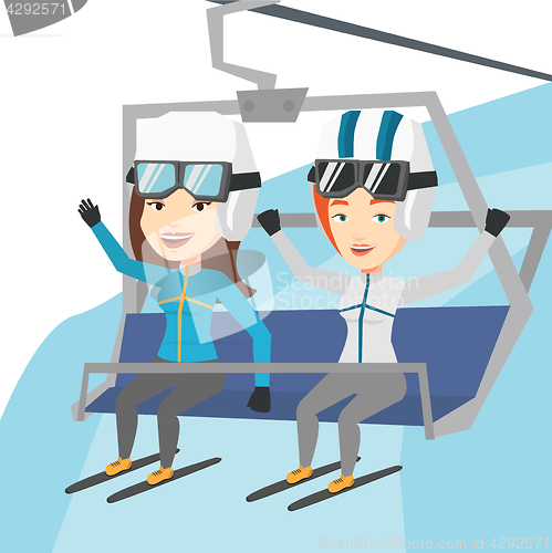 Image of Two happy skiers using cableway at ski resort.