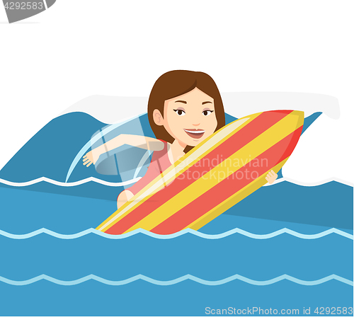Image of Happy surfer in action on a surf board.