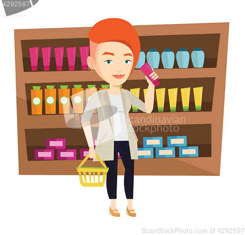 Image of Customer with shopping basket and tube of cream.