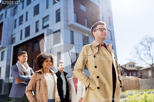 Image of international group of people on city street