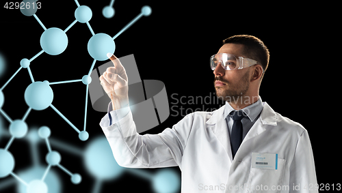 Image of scientist in goggles with molecule projection