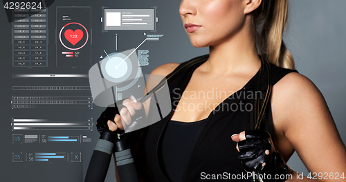 Image of close up of sporty woman with jumping rope