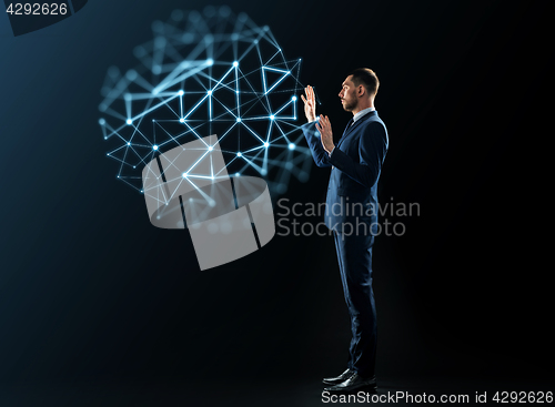 Image of businessman with virtual low poly projection