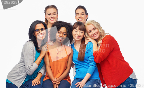 Image of international group of happy women hugging