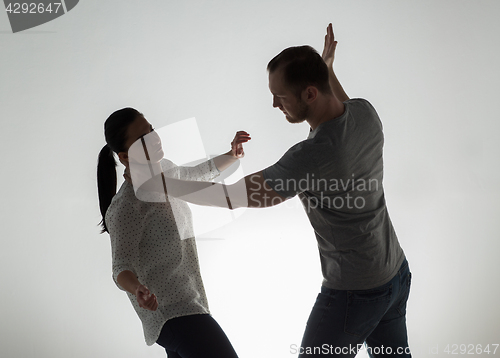 Image of couple having fight and man choking woman