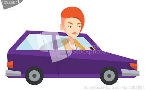 Image of Angry caucasian woman in car stuck in traffic jam.