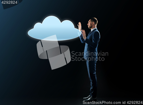 Image of businessman with cloud projection