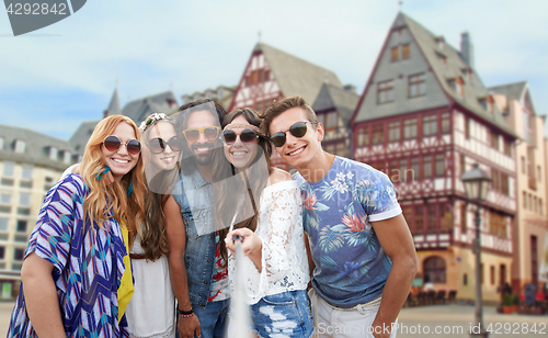 Image of happy hippie friends taking selfie in frankfurt