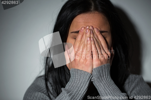 Image of close up of unhappy crying woman