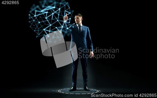 Image of businessman in suit touching