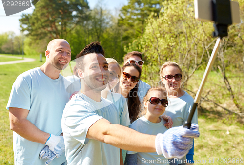 Image of group of volunteers taking smartphone selfie