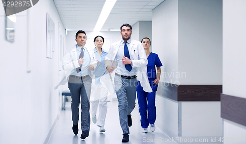 Image of group of medics walking along hospital