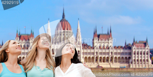 Image of happy women over house of parliament in budapest