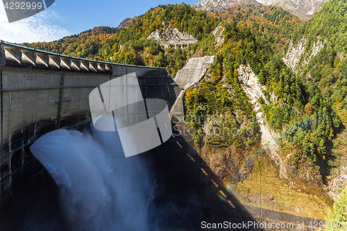 Image of Kurobe Dam and rainbow in Autumn season