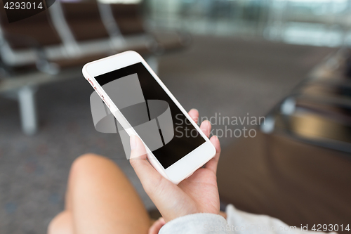 Image of Woman using cellphone