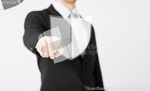 Image of man pointing finger at antivirus program icon