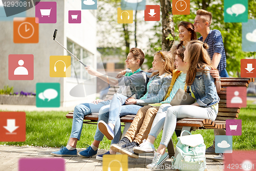 Image of happy teenage students taking selfie by smartphone