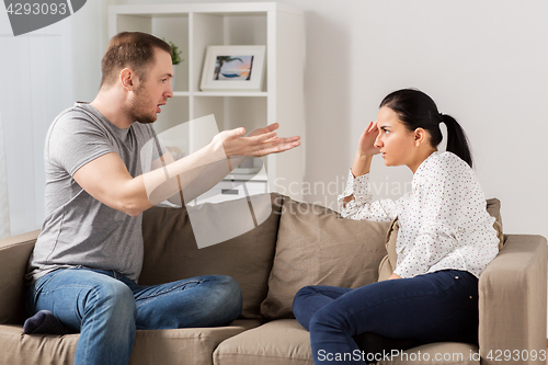 Image of unhappy couple having argument at home