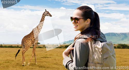 Image of happy woman with backpack traveling in africa