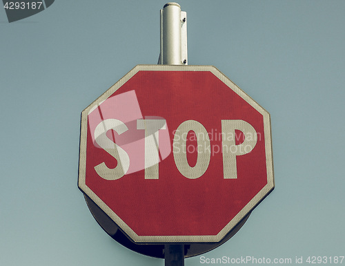 Image of Vintage looking Stop sign over blue sky