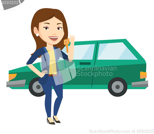 Image of Woman holding keys to her new car.