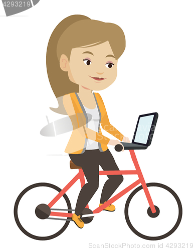 Image of Woman riding bicycle in the city.