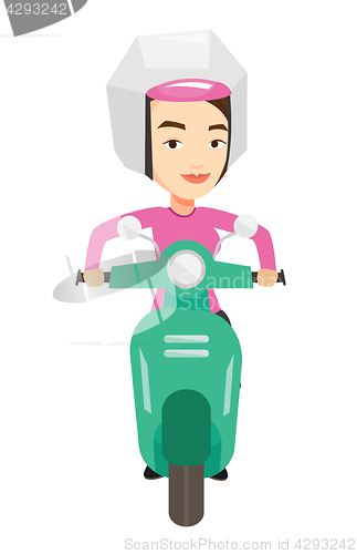 Image of Woman riding scooter in the city.