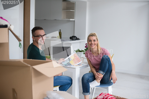 Image of Young couple moving in a new home