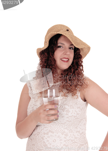 Image of Woman holding glass with water.