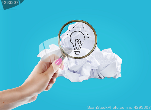 Image of Inspiration concept crumpled paper light bulb metaphor for good idea