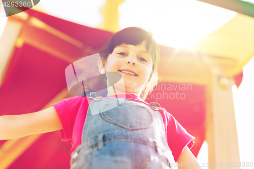 Image of happy little girl on children playground