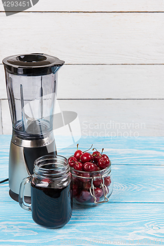 Image of Cherry juice with glass of berries