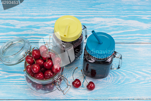 Image of Cherry juice with glass of berries