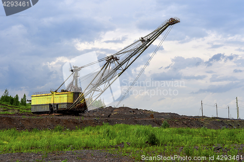 Image of Excavator machine at excavation earthmoving work in quarry