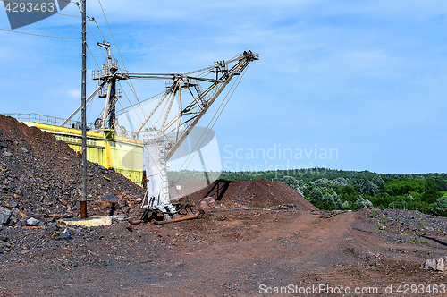 Image of Excavator machine at excavation earthmoving work in quarry