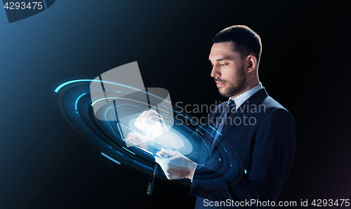 Image of businessman with tablet pc and virtual projection