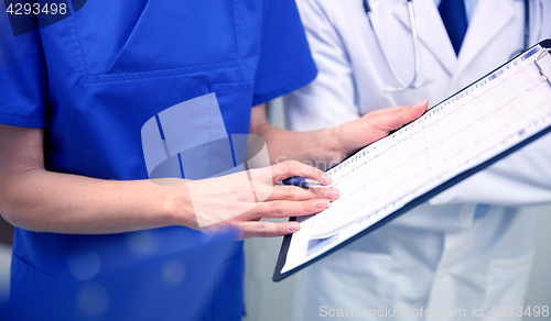 Image of close up of doctors with clipboard at hospital