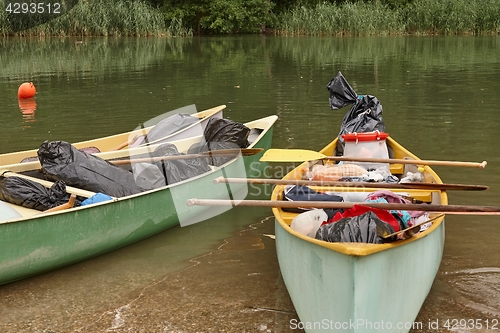 Image of Canoes on the Riverside